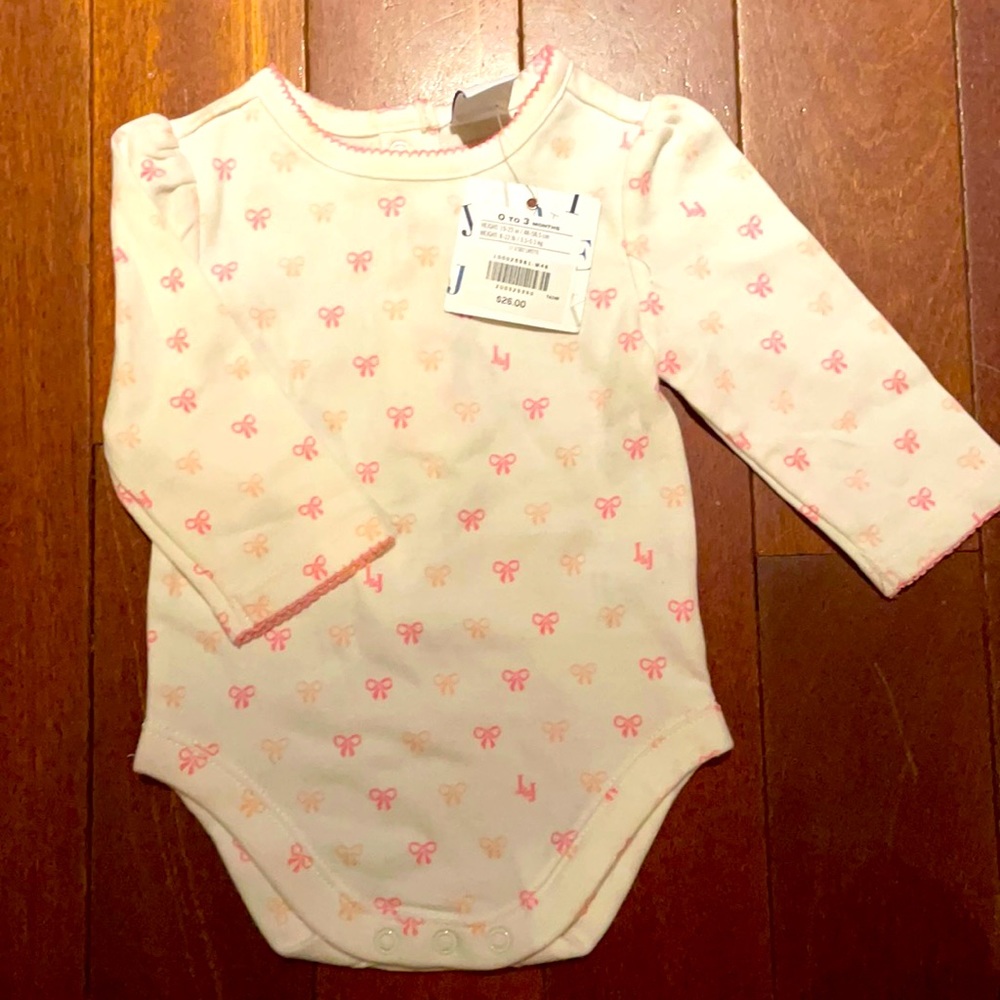 Soft onesie with pink bows! New with tags!